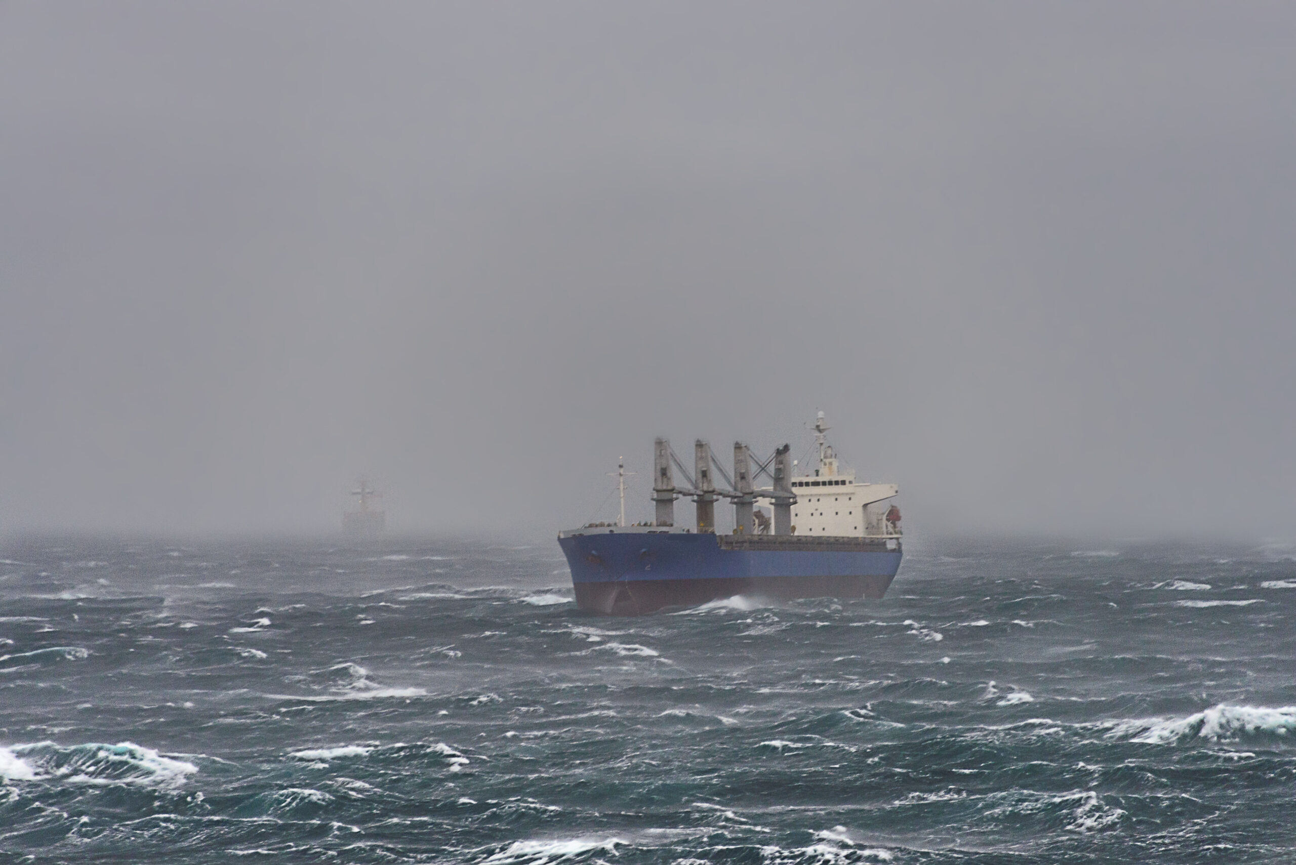 Cargo ship at sea during a storm