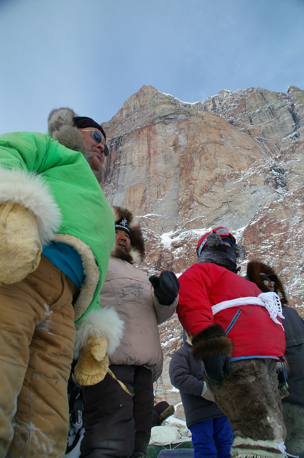 Inughuit from northern Greenland and Inuit from Nunavut, Canada, chatting during a rest stop while enjoying the chance to travel the land together.