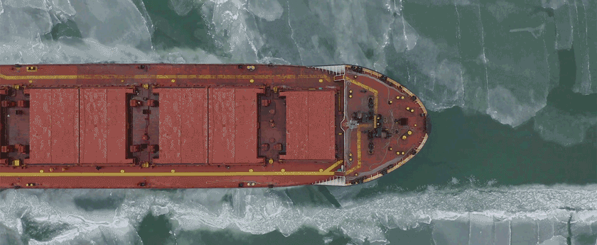 Ship moving through Arctic waters