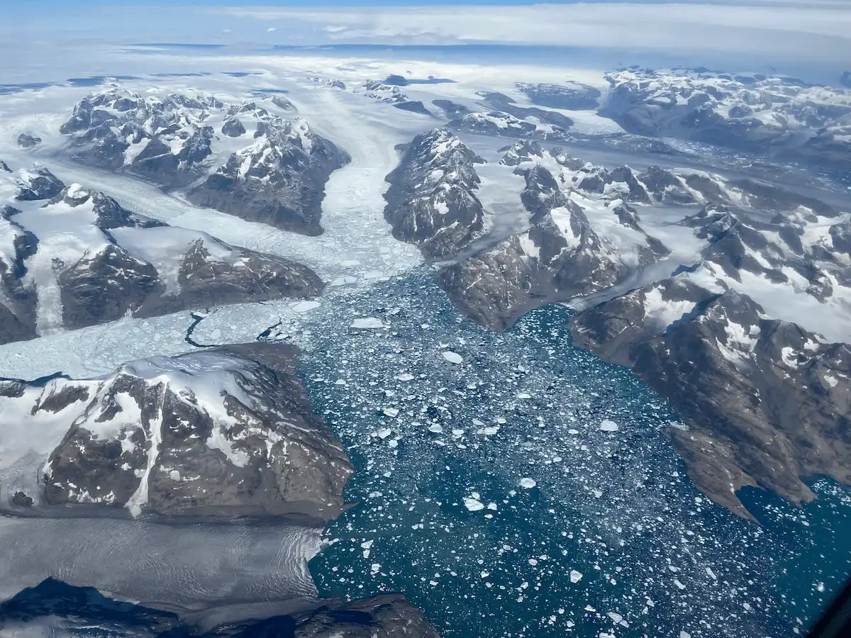 glaciers calving into the see in southeast Greenland, from the air
