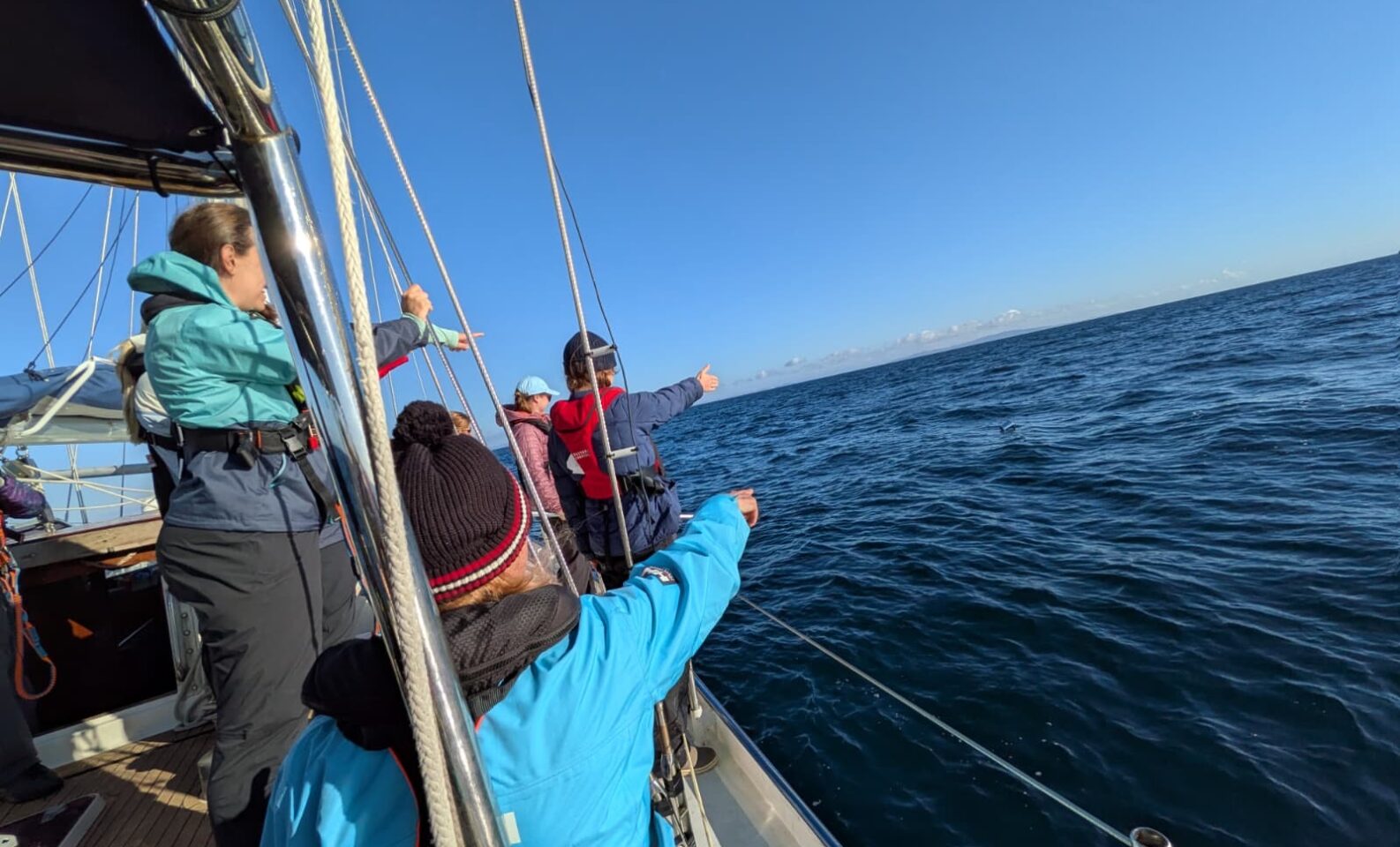 Crew aboard the eXXpedition voyage look out to sea