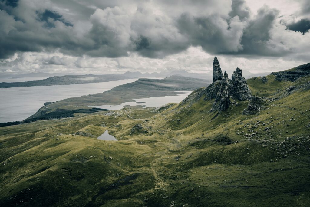 The Old Man of Storr rock formation above a green valley on Skye